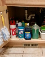 declutter under kitchen sink cabinet