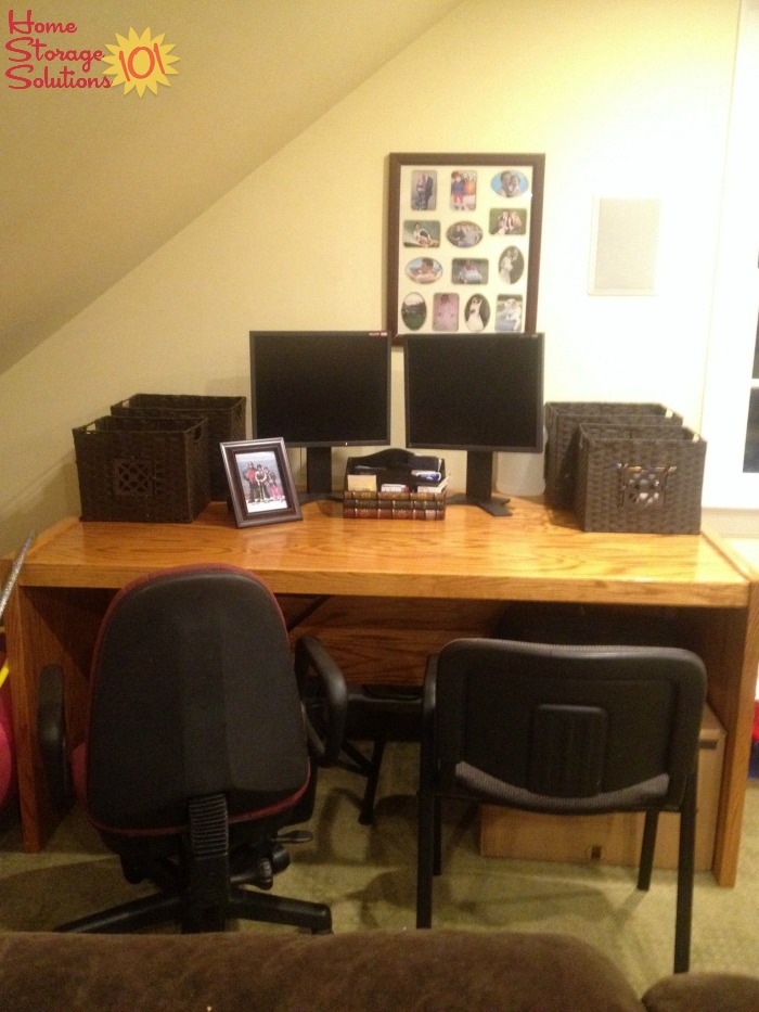 Organized and decluttered home office area in the living room {featured on Home Storage Solutions 101}