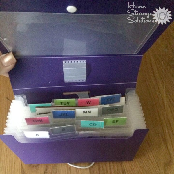 Organizing coupons using an accordion style folder {featured on Home Storage Solutions 101}
